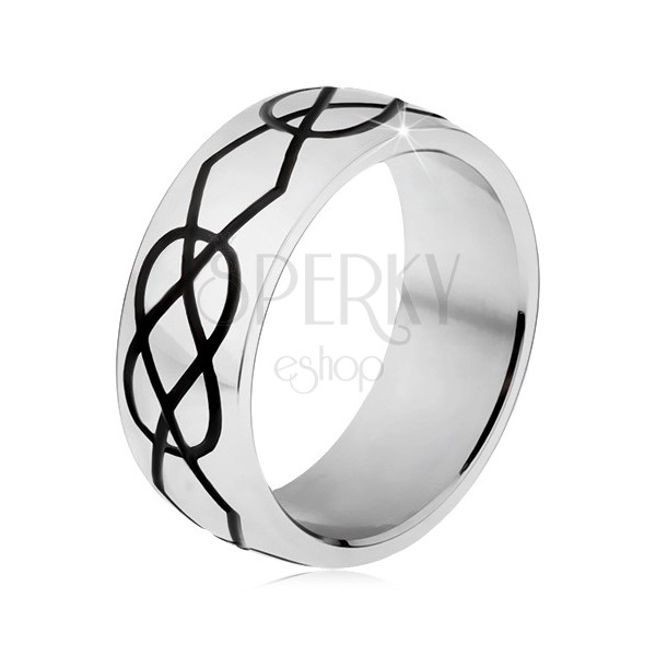 Lśniący stalowy pierścionek, grube czarne nacięcia w kształcie rombów i łezek