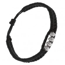 Bransoletka z zaplatanych czarnych sznurków, cztery koraliki z rowkami