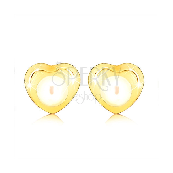 Kolczyki z żółtego złota 9K - małe lśniące serduszko, okrągła perełka