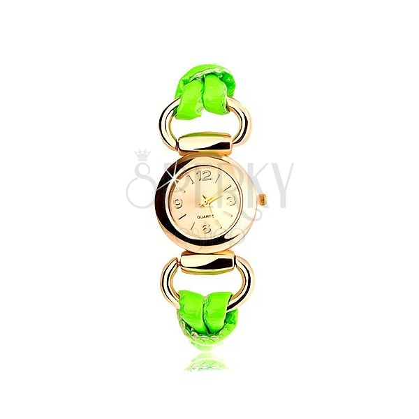Analogowy zegarek, ogrągły cyferblat złotego koloru, lateksowy zielony pasek