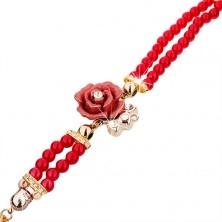Zegarek analogowy, czerwona bransoletka z koralików, cyferblat z cyrkoniami, róża