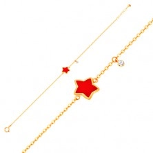 Złota bransoletka 585 z zawieszkami - gwiazda z czerwoną emalią, przezroczysta cyrkonia