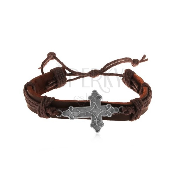 Skórzana bransoletka brązowego koloru ze sznurkami, ozdobnie powycinany duży krzyż