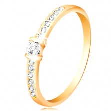 Złoty pierścionek 14K - bezbarwne błyszczące ramiona, podniesiona okrągła cyrkonia bezbarwnego koloru