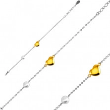 Stalowa bransoletka - gładkie lśniące serduszko złotego koloru, perłowa kuleczka, drobny łańcuszek